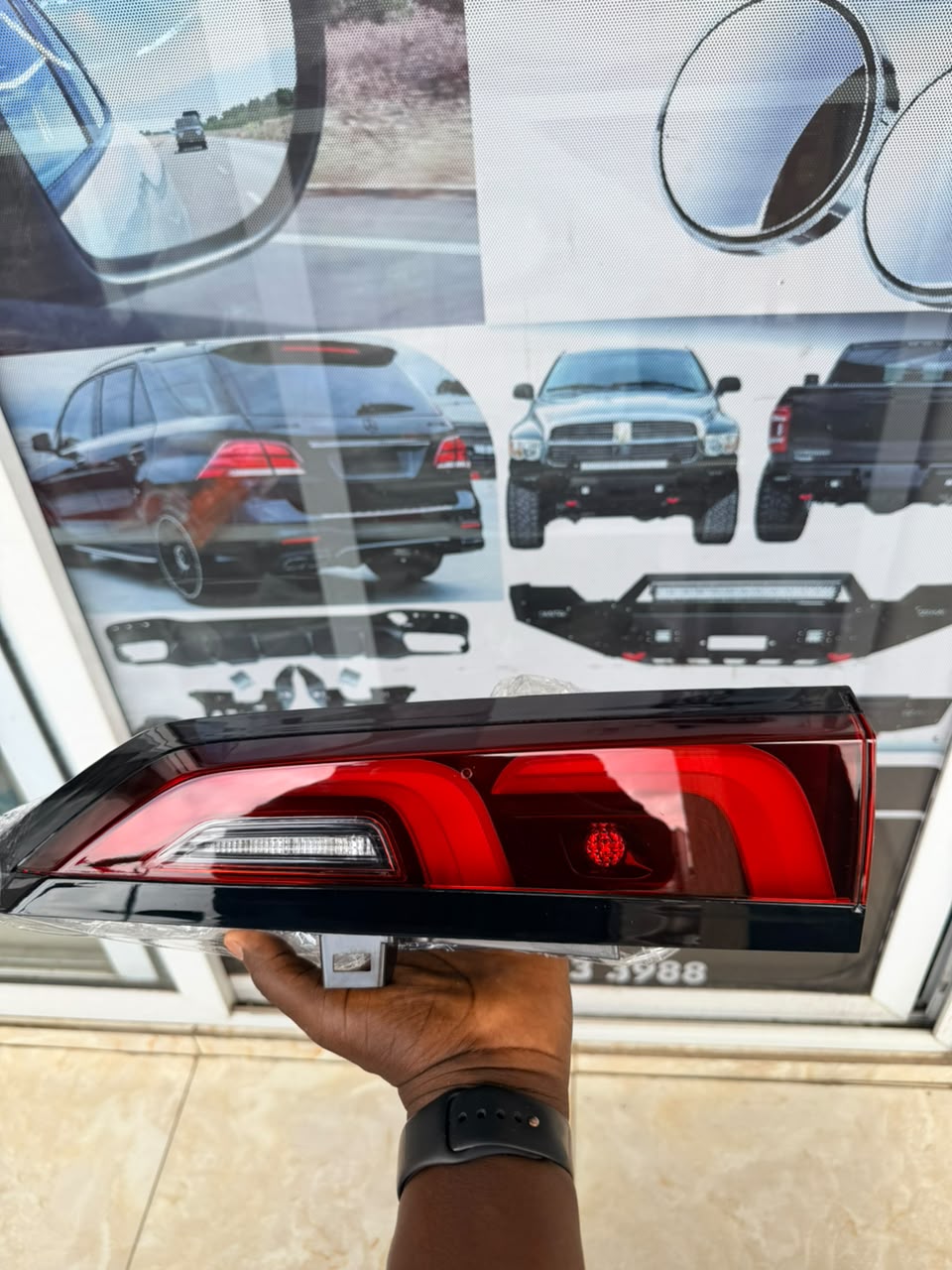 Red tail light assembly with clear sections